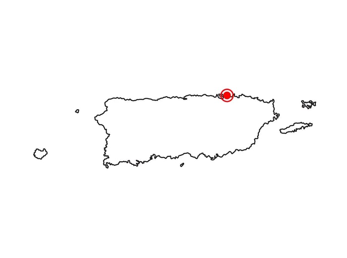 A map highlighting Puerto Rico with a red dot marking San Juan.