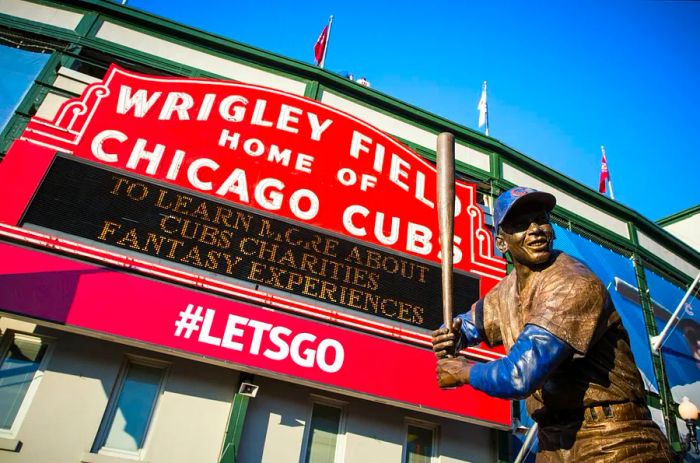 The façade of Wrigley Field in Chicago, featuring a statue of baseball legend Ernie Banks.