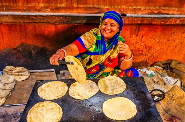 An Indian street vendor making chapatti flatbread in Jaipur, Rajasthan, India.