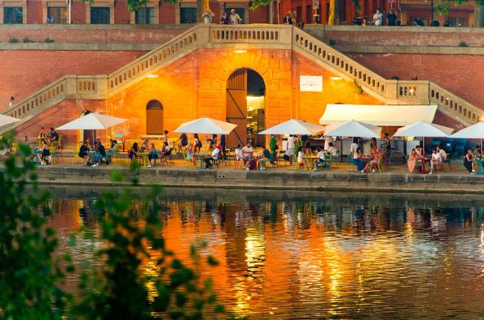 A riverside seasonal cafe, or guinguette, along the Garonne River in Toulouse