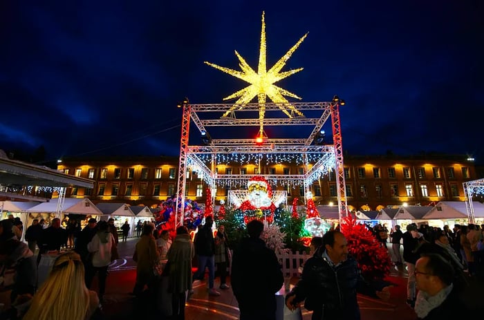 Festive lights and stalls adorn the Christmas market at Place du Capitole, Toulouse.