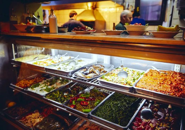 A display of various dishes in a deli counter.