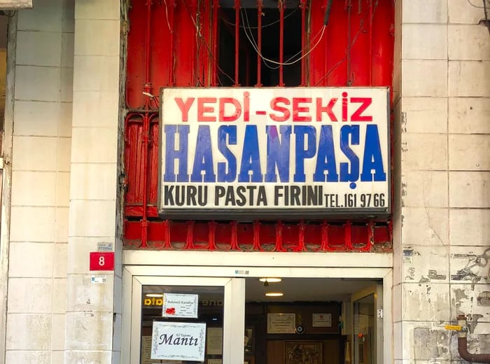 A sign in Turkish displayed on the exterior of a bakery.