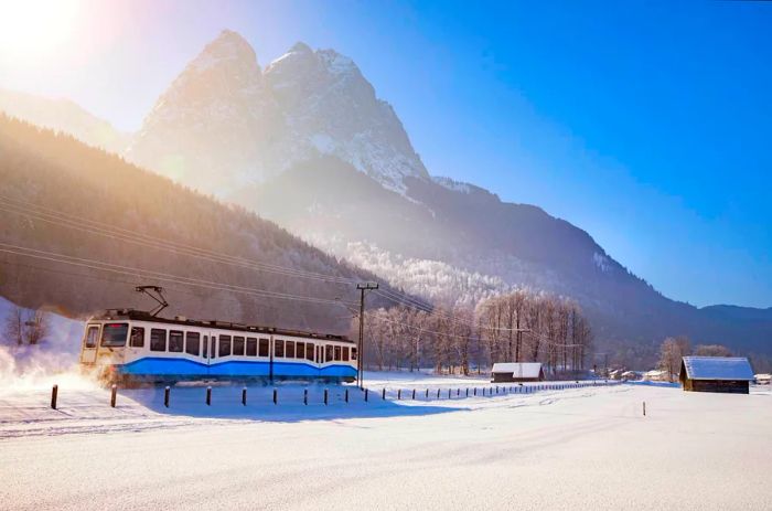 The Zugspitzbahn mountain railway runs at the base of Zugspitz during winter in the Bavarian Alps.