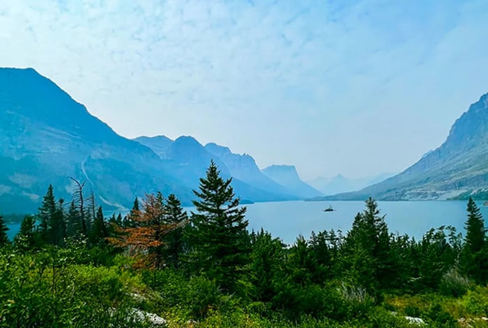 A picturesque lake framed by mountains.