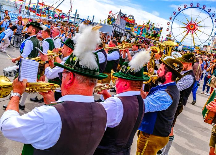 Participants dressed in traditional Bavarian attire play trumpets to kick off Frühlingsfest (Spring Festival) in Munich, Bavaria, Germany.