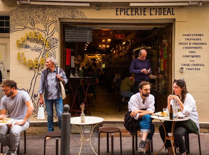 Outdoor tables set up along the sidewalk at L’Epicerie Ideal