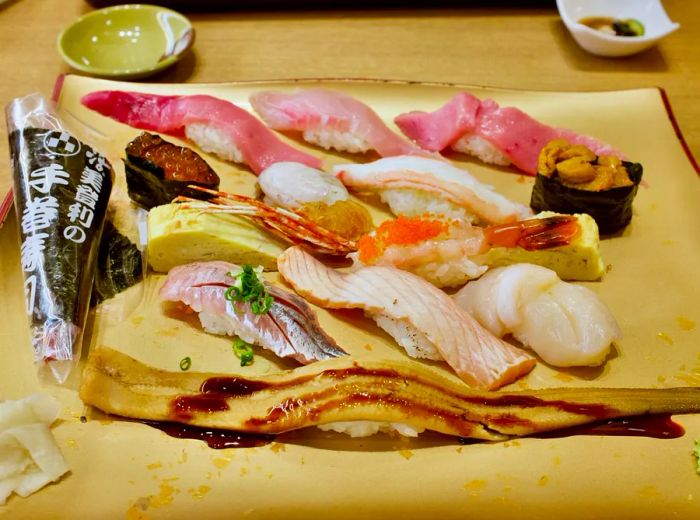 An assortment of sushi arranged on a tray.