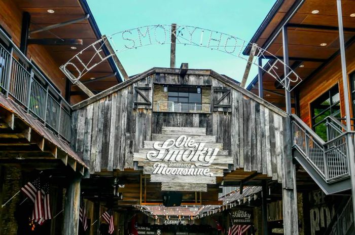 The charming wooden facade of the Ole Smoky Moonshine building in Gatlinburg, Tennessee.