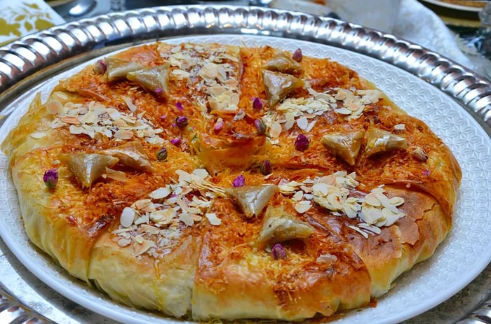 Bastila, or Pastilla, is a traditional Moroccan dish. Chicken Bastila is a savory pie filled with chicken, eggs, onions, and sugar. In some regions, it may be made with pigeon meat or fish.