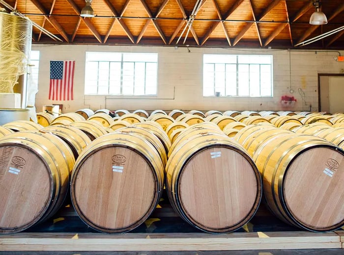 A vast warehouse filled with barrels.