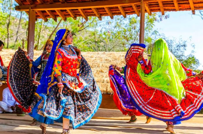 Performers showcasing traditional folk dance in Udaipur, Rajasthan, India.