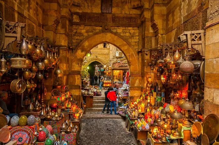 A vibrant market shop adorned with colorful lights and lanterns lining the walls.