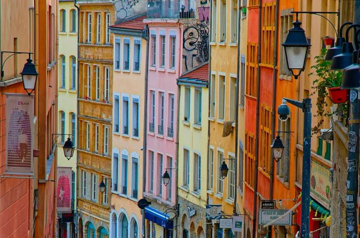 Charming colorful buildings line the sloping streets in the Pentes de la Croix Rousse area of Lyon.