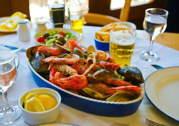 A delectable seafood spread on a restaurant table in Malta.