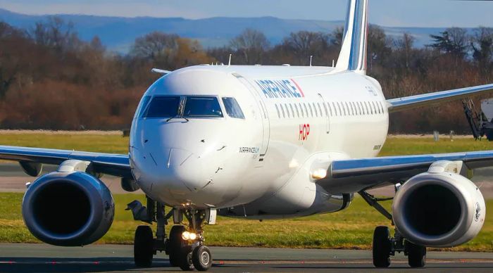 An Air France Embraer 170 taxiing on the runway