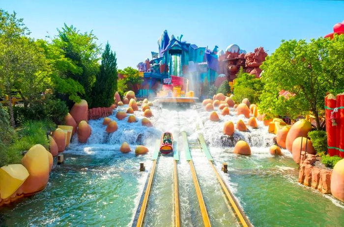 Visitors enjoy a log flume ride at Universal, Florida, on a bright, sunny day.