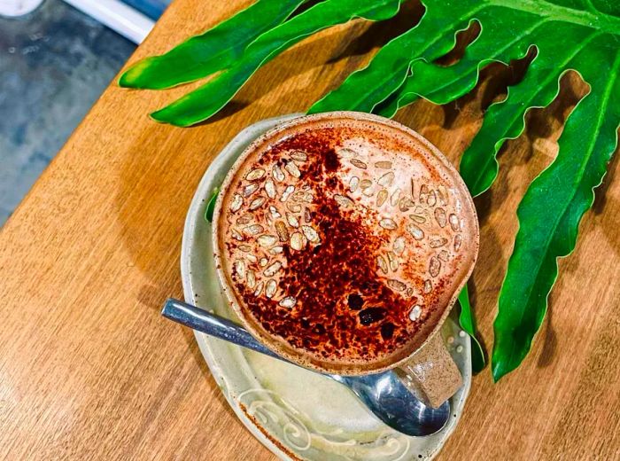 Aerial view of a latte adorned with intricate, streaked foam.