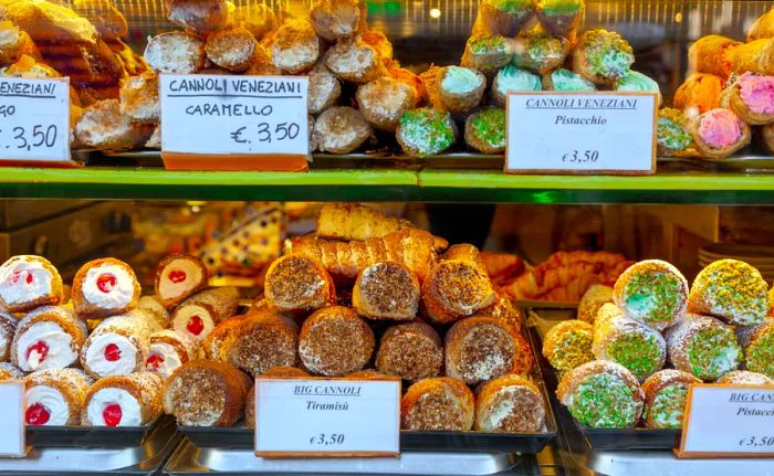 Cannoli and other delightful pastries displayed in a pasticceria in Italy