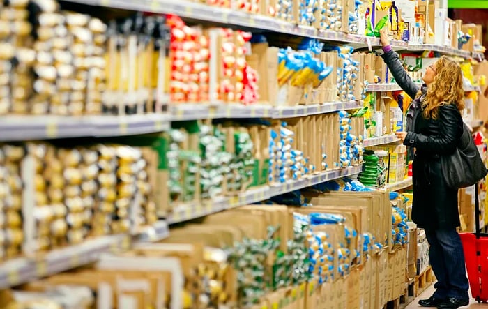 Woman selecting pasta in an Italian supermarket