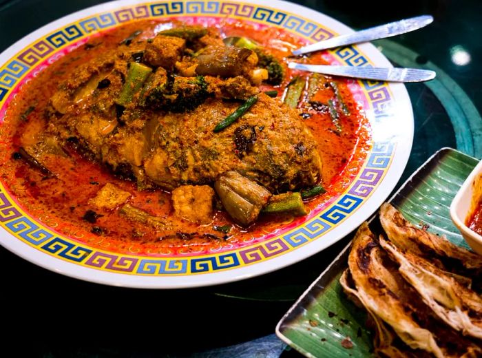 A beautifully presented dish featuring a hearty fish head curry.