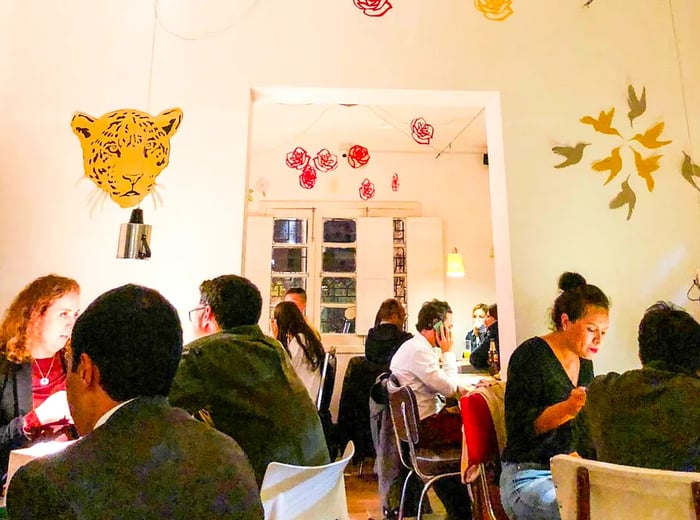 A bright dining area bustling with guests.