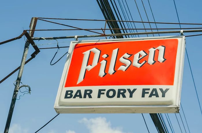 A sign promoting Pilsen and Bar Fory Fay.