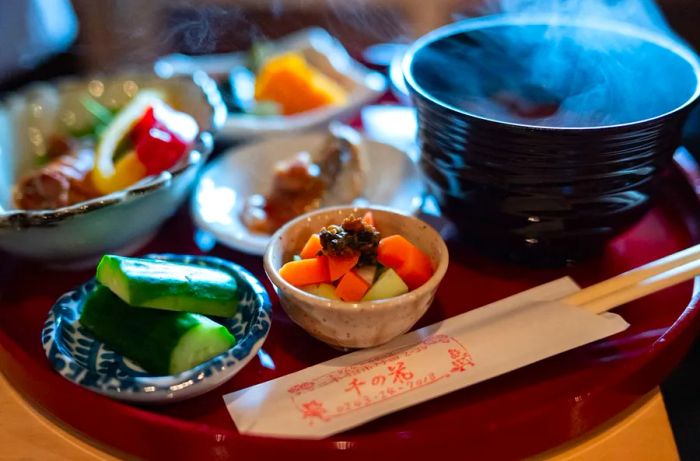 An assortment of dishes beautifully arranged on a tray.