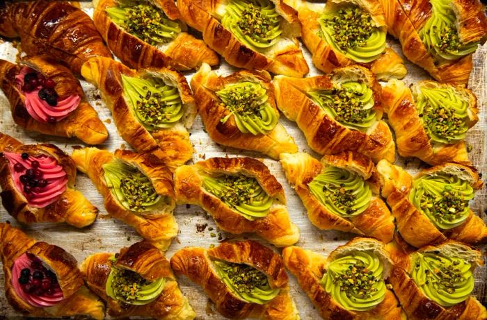 Cornetti stuffed with fruit and pistachio cream.