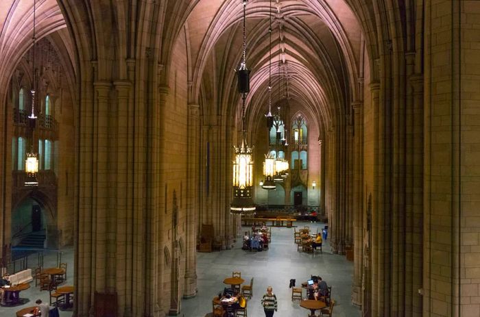 Students and readers enjoy the expansive interior of the neo-Gothic Cathedral of Learning at the University of Pittsburgh