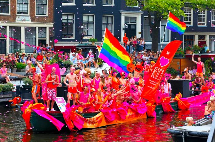 Participants celebrate at the iconic Canal Parade of Pride in Amsterdam.