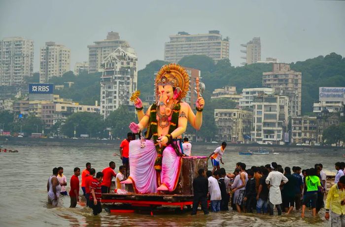 Devotees immerse a massive idol of Ganesh during the Ganesh Chaturthi festival in Mumbai.