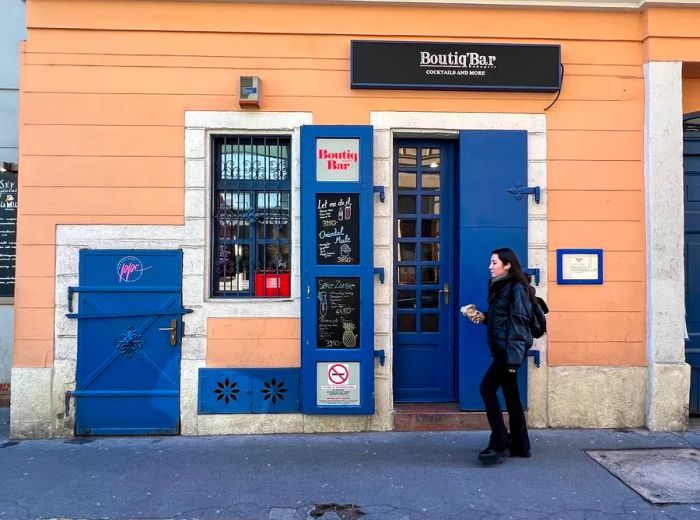 A patron is seen standing at the entrance of the bar.