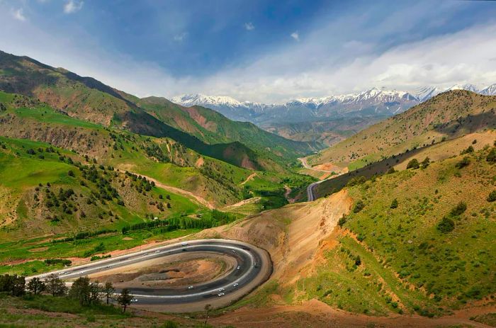 A scenic view of the winding roads and mountains between Tashkent and the Fergana Valley in Uzbekistan