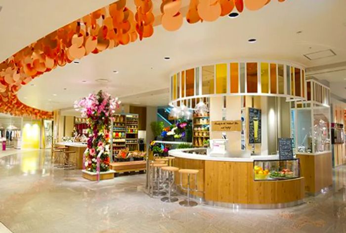 A dazzling mall interior featuring seats arranged at various counters.