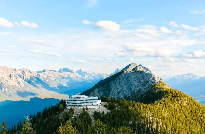 A contemporary building perched atop a mountain.