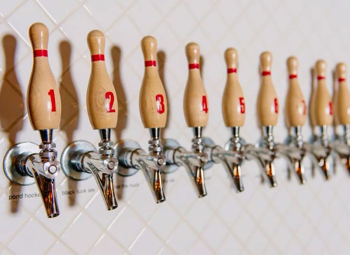 Beer taps designed like bowling pins.