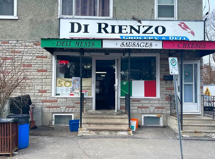 A storefront adorned in the colors of the Italian flag, proudly displaying the name Di Rienzo.