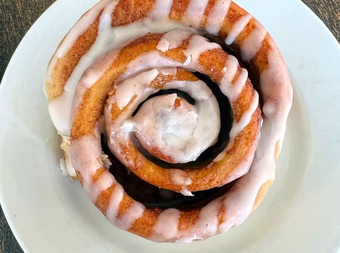 A close-up view of a cinnamon roll.