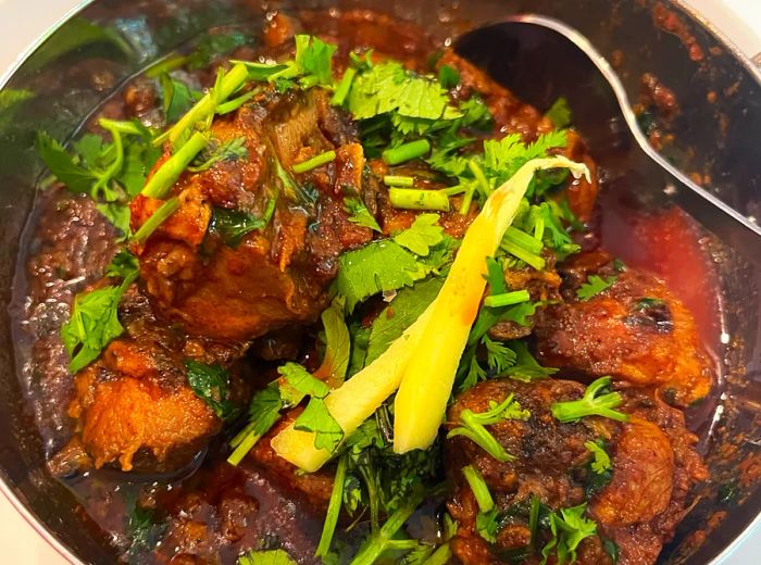 A hearty stew garnished with cilantro.