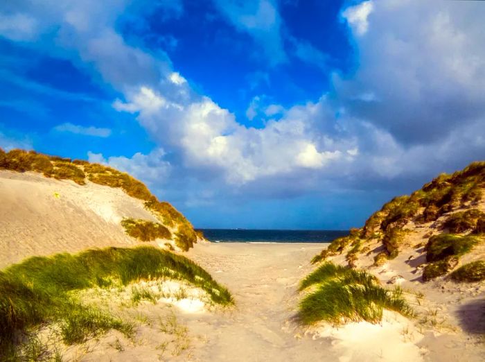 West Beach boasts a sprawling expanse of fine machair; pristine white shell sand, on the island of Berneray, a small isle connected to North Uist by a constructed causeway. The Western Isles are renowned for their breathtaking Atlantic beaches.