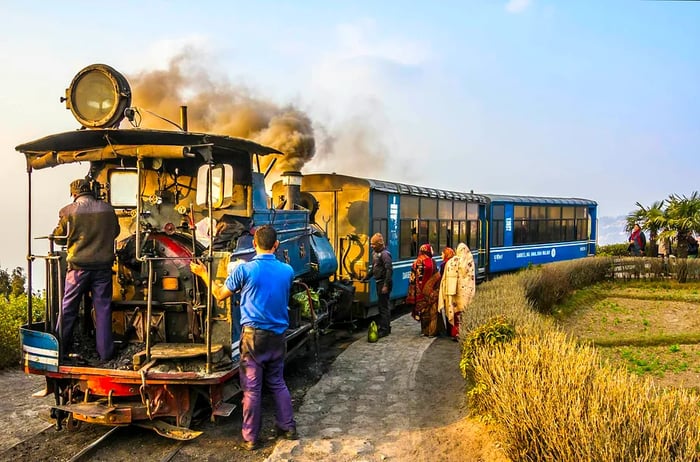 The Darjeeling toy train making a stop at the Batasia Loop.