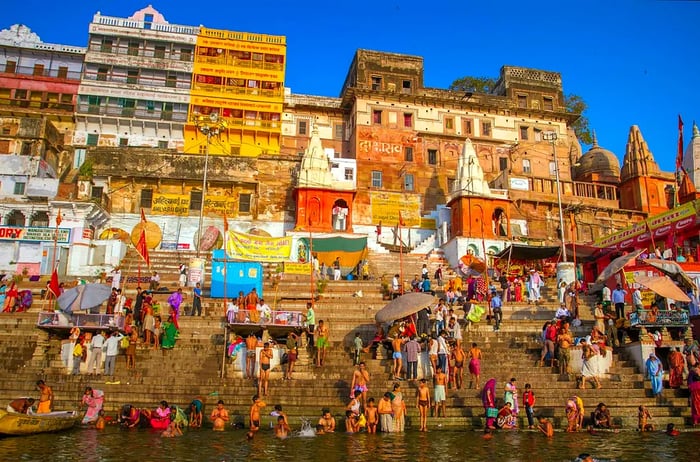 On the auspicious Maha Shivaratri festival, Hindu devotees immerse themselves in the sacred waters of the Ganges at Dasashwamedh Ghat in Varanasi, Uttar Pradesh, India.