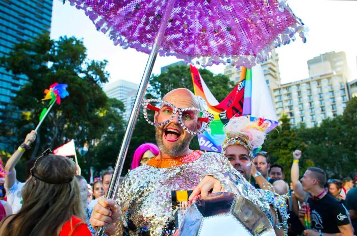 A participant in the parade strikes a pose for the camera in the marshalling area at the 2016 Sydney Gay & Lesbian Mardi Gras in Hyde Park.