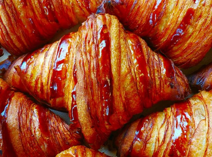 A close-up view of freshly baked croissants.