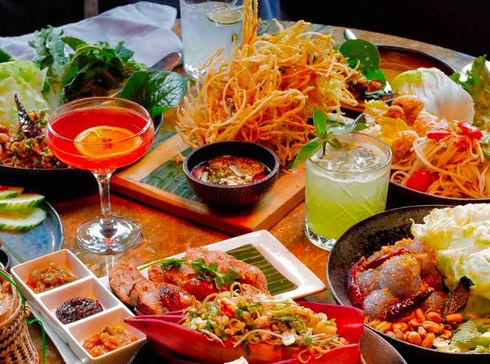 An assortment of noodles, salads, rice dishes, and beverages.