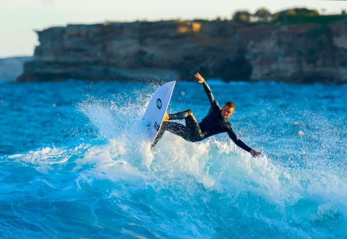 Surfer riding waves at Tamarama Beach