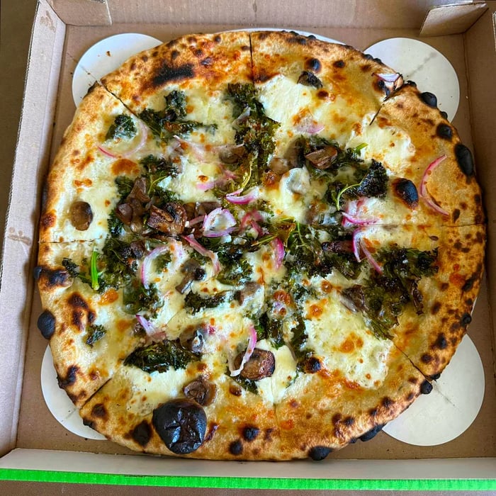 Kale pizza topped with zesty garlic at Side Pie in Los Angeles.