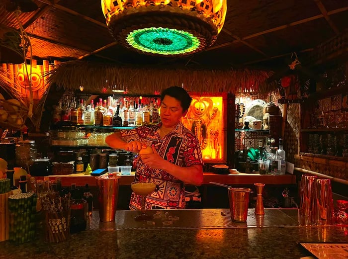 A bartender crafts a drink at The Lucky Tiki, celebrating the golden era of LA cocktail lounges.