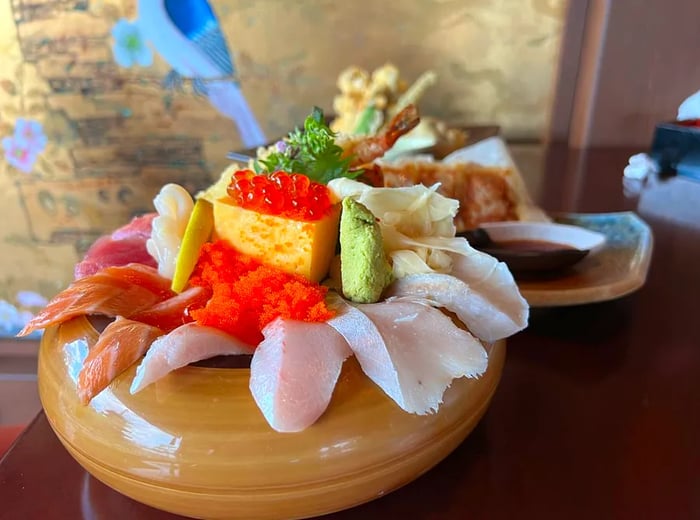 A selection of sashimi and various small bites.